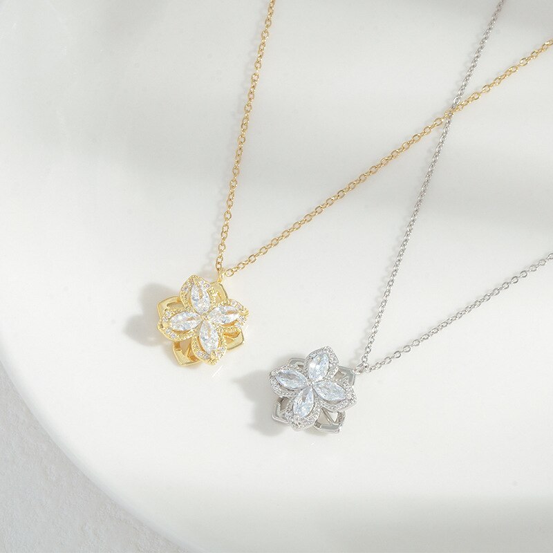 Rotating four leaf crystal necklace