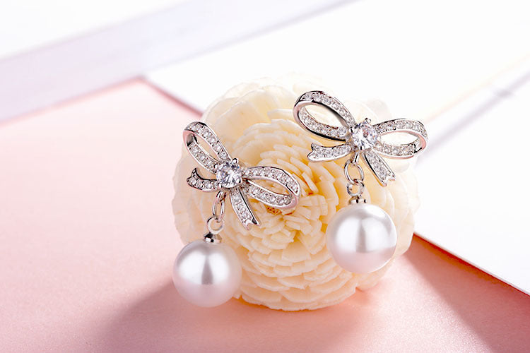 Bow pearl gold plated crystal earrings
