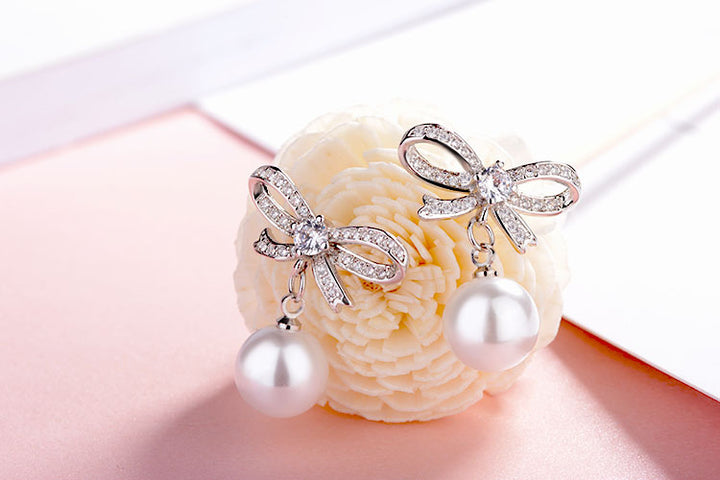 Bow pearl gold plated crystal earrings