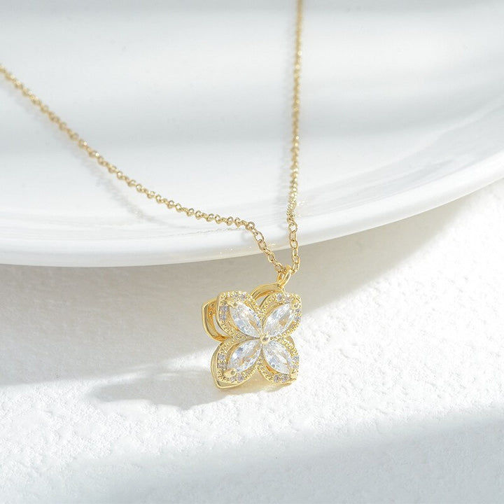 Rotating four leaf crystal necklace